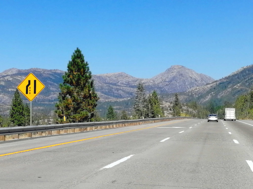 View of mountains in the distance on a freeway